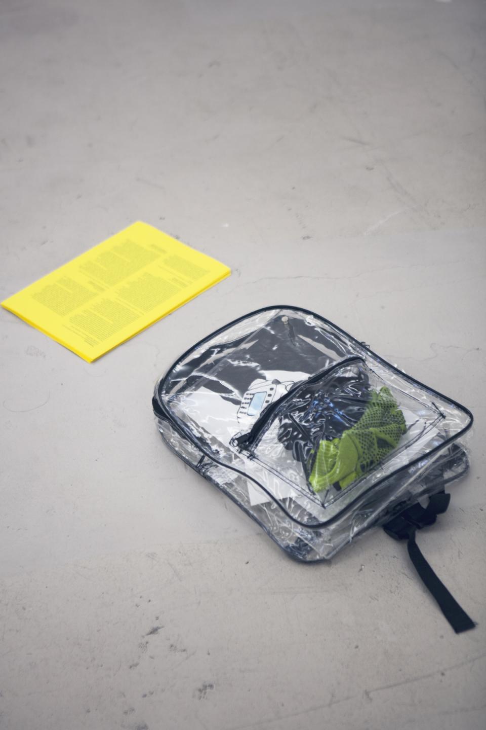 Transparencies: 3 (or 6) Definition..., 2018, Lecture Performance, Essayentwurf, Transparenter Rucksack, Acrylfarbe und Tinte auf Papier, Arbeitshandschuhe, Holster für Barcode Scanner